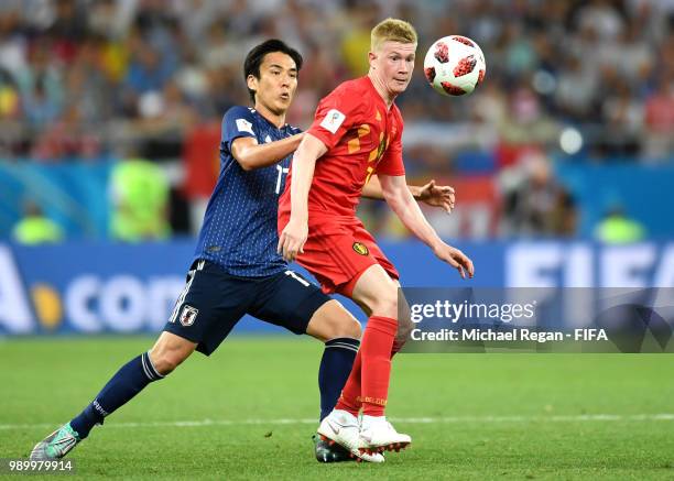 Kevin De Bruyne of Belgium is challenged by Makoto Hasebe of Japan during the 2018 FIFA World Cup Russia Round of 16 match between Belgium and Japan...