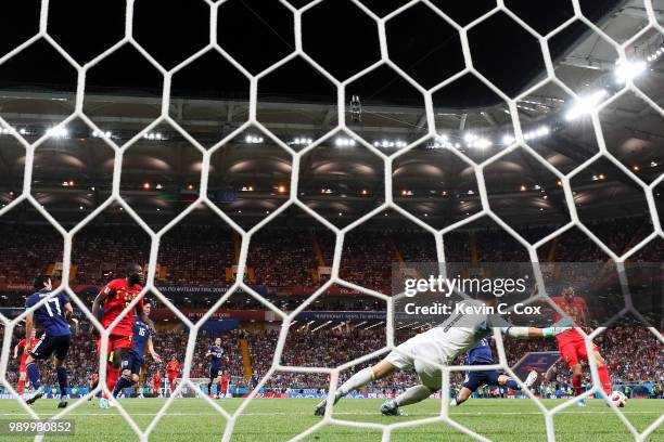 Nacer Chadli of Belgium scores past Eiji Kawashima of Japan his team's third goal during the 2018 FIFA World Cup Russia Round of 16 match between...