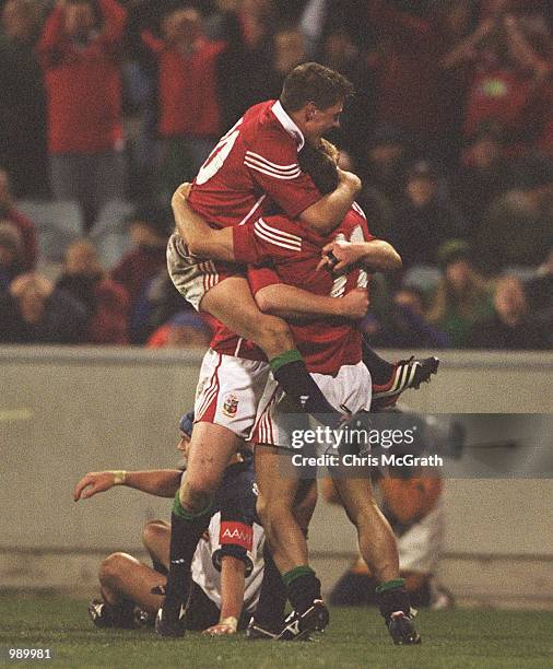 Austin Healey of the British and Irish Lions is mobbed by teamates after scores the try that won the match for the Lions in the match between the...