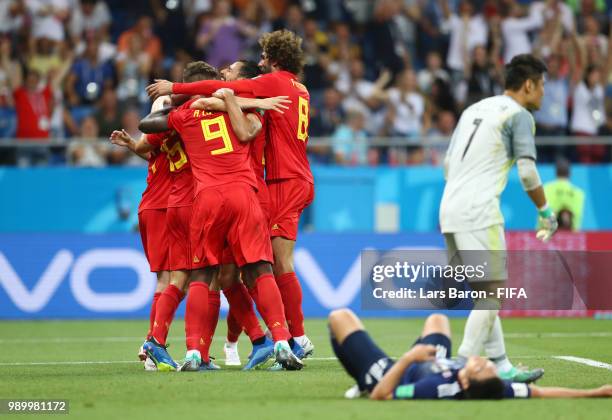 Nacer Chadli of Belgium celebrates after scoring his team's third goal with team mates during the 2018 FIFA World Cup Russia Round of 16 match...