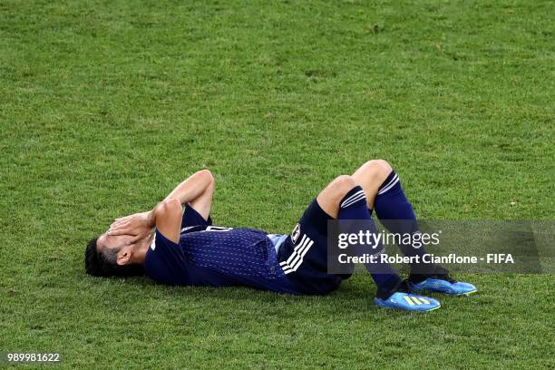 Shinji Kagawa of Japan looks dejected following his sides defeat in the 2018 FIFA World Cup Russia Round of 16 match between Belgium and Japan at...