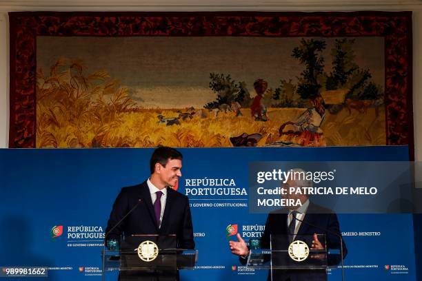 Portuguese Prime Minister Antonio Costa and his Spanish counterpart Pedro Sanchez give a joint press conference after their meeting at Comercio...