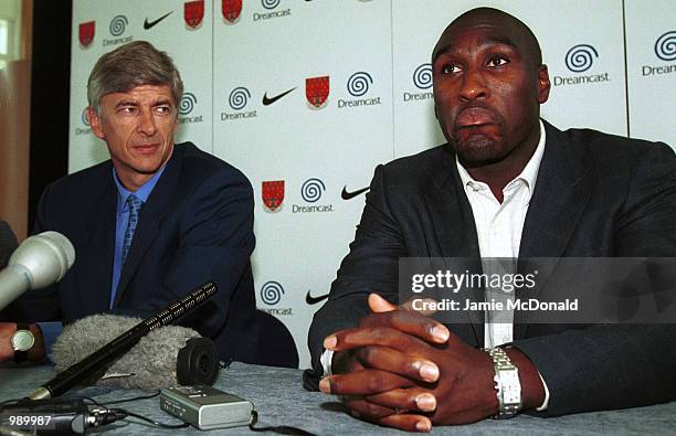 Sol Campbell with manager Arsene Wenger during a press conference at Arsenals training ground, London Colney, to announce his signing for Arsenal...