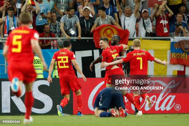 Belgium's midfielder Nacer Chadli celebrates with teammates after scoring during the Russia 2018 World Cup round of 16 football match between Belgium...