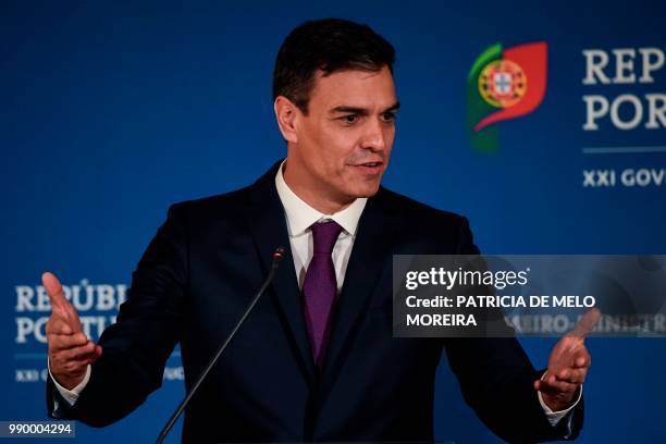 Spanish Prime Minister Pedro Sanchez speaks during a joint press conference with his Portugese counterpart after their meeting at Comercio square in...