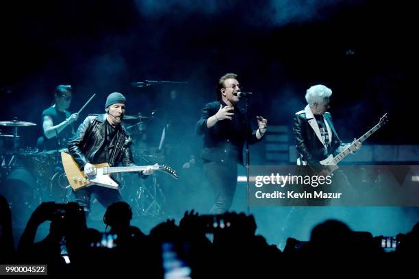 Larry Mullen Jr., The Edge, Bono and Adam Clayton of U2 perform on stage during the "eXPERIENCE & iNNOCENCE" tour at Madison Square Garden on July 1,...