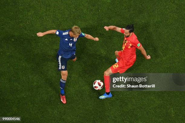 Nacer Chadli of Belgium is challenged by Keisuke Honda of Japan during the 2018 FIFA World Cup Russia Round of 16 match between Belgium and Japan at...