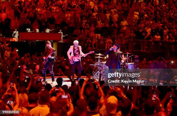 Larry Mullen Jr., The Edge, Bono and Adam Clayton of U2 perform on stage during the "eXPERIENCE & iNNOCENCE" tour at Madison Square Garden on July 1,...