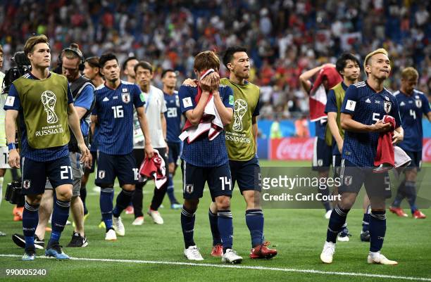 Gotoku Sakai, Takashi Inui, Shinji Okazaki and Yuto Nagatomo of Japan walks off the pitch dejected folowing the 2018 FIFA World Cup Russia Round of...