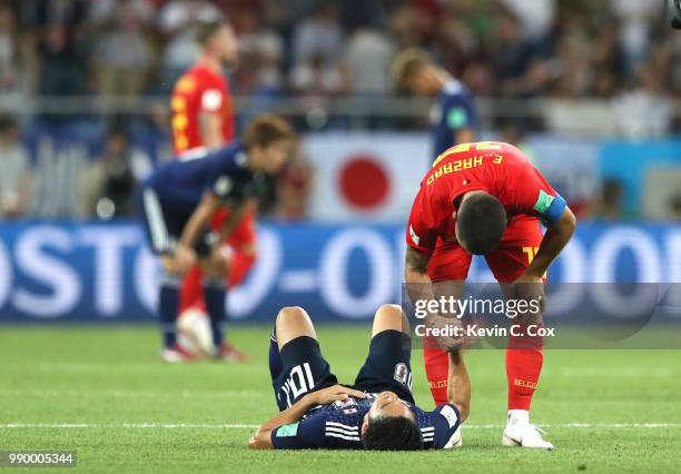 Eden Hazard of Belgium consoles Shinji Kagawa of Japan following Japan's defeat in the 2018 FIFA World Cup Russia Round of 16 match between Belgium...