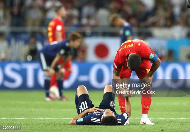 Romelu Lukaku of Belgium consoles Shinji Kagawa of Japan during the 2018 FIFA World Cup Russia Round of 16 match between Belgium and Japan at Rostov...