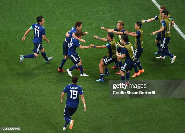 Takashi Inui of Japan celebrates after scoring his team's second goal during the 2018 FIFA World Cup Russia Round of 16 match between Belgium and...