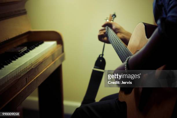 playing the guitar - ébano imagens e fotografias de stock