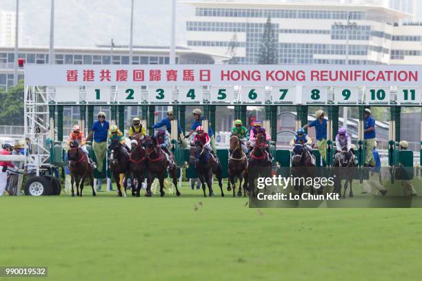 Jockeys compete the Race 3 Uncompromising Integrity 2000m Handicap during the Hong Kong Reunification race day at Sha Tin racecourse on July 1 , 2018...