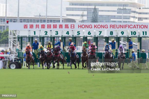 Jockeys compete the Race 3 Uncompromising Integrity 2000m Handicap during the Hong Kong Reunification race day at Sha Tin racecourse on July 1 , 2018...