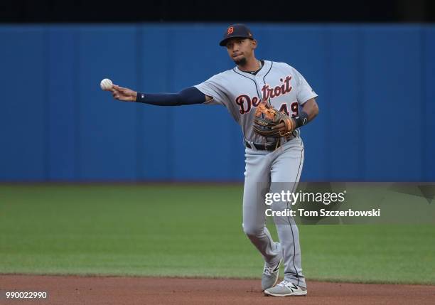 Dixon Machado of the Detroit Tigers makes the play and throws out the baserunner in the second inning during MLB game action against the Toronto Blue...