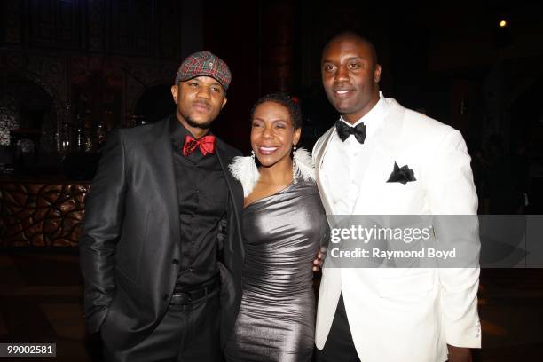 Actor Hosea Chanchez, dancer Andrea Kelly and New York Giants football player Danny Clark pose for photos during "Le Moulin Rouge, A Night In Paris"...