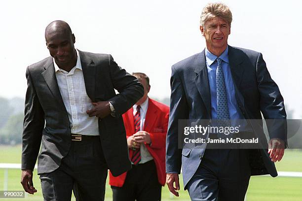 Sol Campbell and manager Arsene Wenger during a press conference at Arsenals training ground, London Colney, to announce his signing for Arsenal...