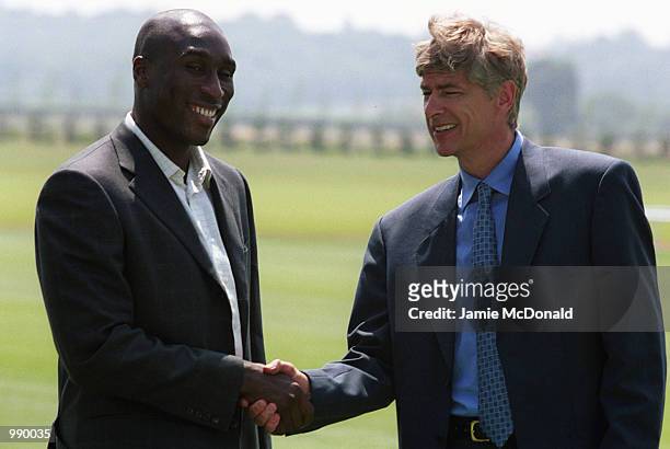 Sol Campbell and manager Arsene Wenger during a press conference at Arsenals training ground, London Colney, to announce his signing for Arsenal...