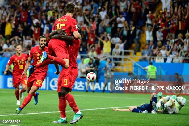 Belgium's forward Romelu Lukaku c celebrates with Belgium's defender Thomas Meunier after Belgium's midfielder Nacer Chadli scored his team's third...