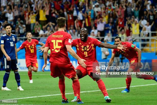 Belgium's forward Romelu Lukaku celebrates with Belgium's defender Thomas Meunier after Belgium's midfielder Nacer Chadli scored his team's third...