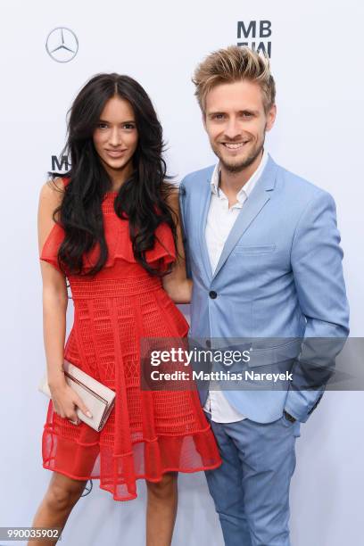 Hanna Weig and Joern Schloenvoigt attend the Guido Maria Kretschmer show during the Berlin Fashion Week Spring/Summer 2019 at ewerk on July 2, 2018...