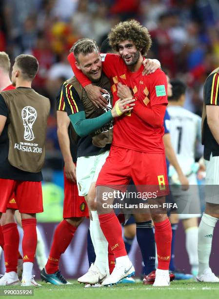 Marouane Fellaini of Belgium and Simon Mignolet of Belgium celebrate victory following the 2018 FIFA World Cup Russia Round of 16 match between...