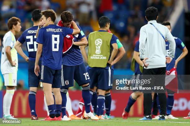 Genki Haraguchi of Japan and Hiroki Sakai of Japan look dejected following their sides defeat in the 2018 FIFA World Cup Russia Round of 16 match...