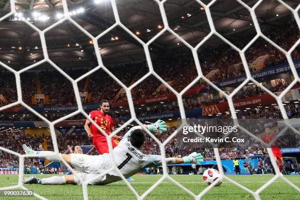 Nacer Chadli of Belgium scores past Eiji Kawashima of Japan his team's third goal during the 2018 FIFA World Cup Russia Round of 16 match between...