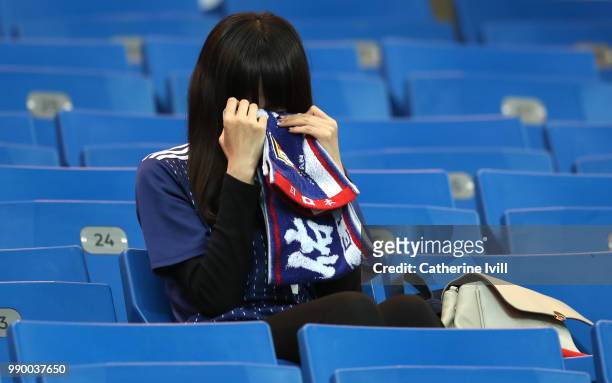 Japan fan looks dejected following his sides defeat in the 2018 FIFA World Cup Russia Round of 16 match between Belgium and Japan at Rostov Arena on...