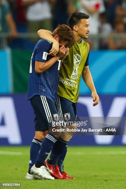 Shinji Okazaki of Japan consoles Takashi Inui of Japan at the end of the 2018 FIFA World Cup Russia Round of 16 match between Belgium and Japan at...