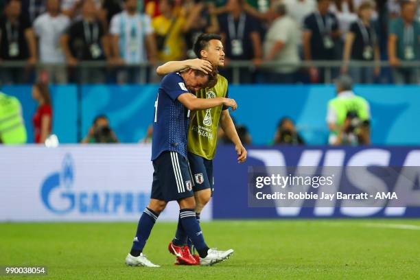 Shinji Okazaki of Japan consoles Takashi Inui of Japan at the end of the 2018 FIFA World Cup Russia Round of 16 match between Belgium and Japan at...