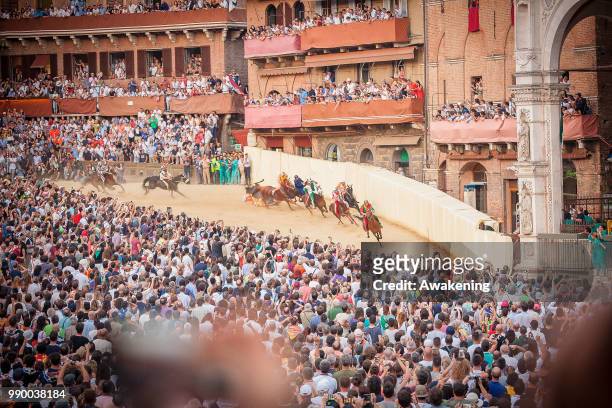 Jockeys compete in the historical Italian horse race of the Palio Di Siena on July 02, 2018 in Siena, Italy. The Palio di Siena, known locally simply...