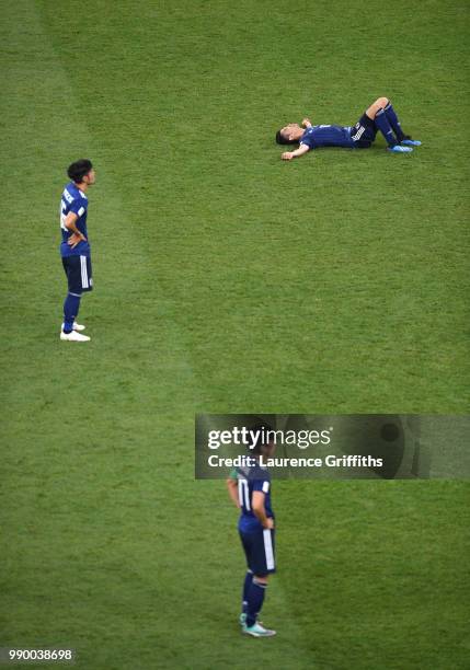 Shinji Kagawa of Japan lies on the pitch dejected followig the 2018 FIFA World Cup Russia Round of 16 match between Belgium and Japan at Rostov Arena...