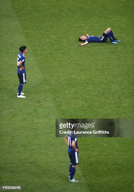 Shinji Kagawa of Japan lies on the pitch dejected followig the 2018 FIFA World Cup Russia Round of 16 match between Belgium and Japan at Rostov Arena...
