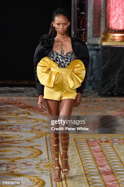 Adesuwa Aighewi walks the runway during the Redemption Haute Couture Fall Winter 2018/2019 show as part of Paris Fashion Week on July 2, 2018 in...