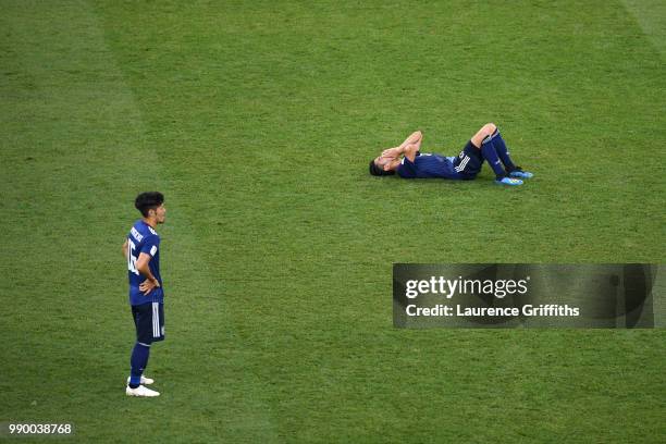 Shinji Kagawa of Japan lies on the pitch dejected followig the 2018 FIFA World Cup Russia Round of 16 match between Belgium and Japan at Rostov Arena...