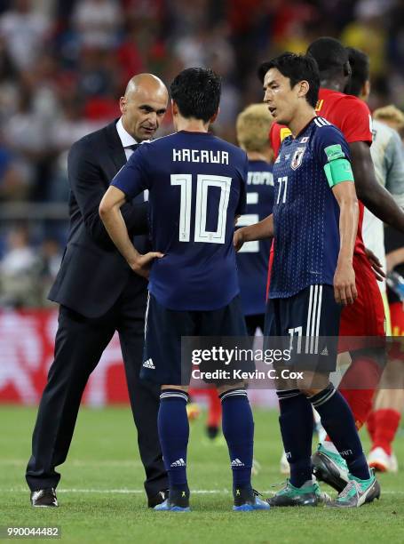 Roberto Martinez, Head coach of Belgium congratulates Shinji Kagawa and Makoto Hasebe of Japan following the 2018 FIFA World Cup Russia Round of 16...