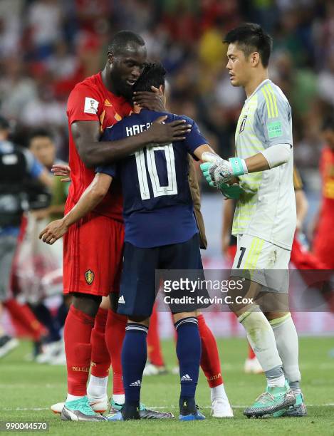 Shinji Kagawa of Japan is consoled by Romelu Lukaku of Belgium during the 2018 FIFA World Cup Russia Round of 16 match between Belgium and Japan at...