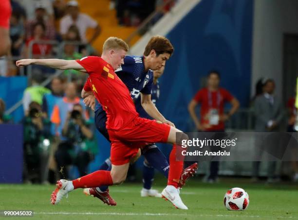 Yuya Osaka of Japan in action against Kevin de Bruyne of Belgium during the 2018 FIFA World Cup Russia Round of 16 match between Belgium and Japan at...