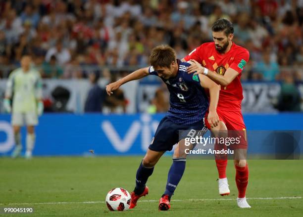 Yannick Carrasco of Belgium in action against Genki Haraguchi of Japan during the 2018 FIFA World Cup Russia Round of 16 match between Belgium and...