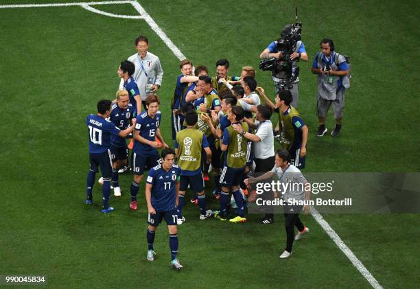 Takashi Inui of Japan celebrates with teammates after scoring his team's second goal during the 2018 FIFA World Cup Russia Round of 16 match between...