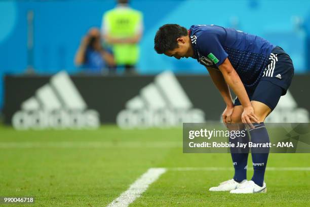 Yuya Osako of Japan looks dejected after Nacer Chadli of Belgium's winning goal during the 2018 FIFA World Cup Russia Round of 16 match between...