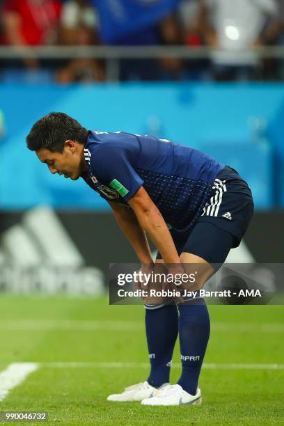 Yuya Osako of Japan looks dejected after Nacer Chadli of Belgium's winning goal during the 2018 FIFA World Cup Russia Round of 16 match between...