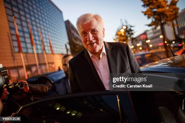 Horst Seehofer, German Interior Minister and leader of the Bavarian Social Union leaves the CDU-headquarter after meeting with German Chancellor and...