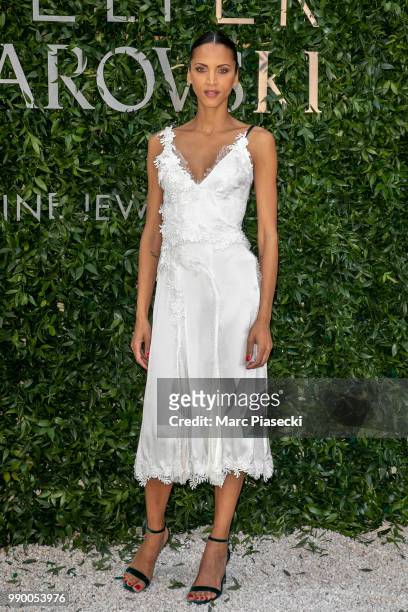 Model Noemie Lenoir attends the Atelier Swarovski : Cocktail Of The New Penelope Cruz Fine Jewelry Collection as part of Paris Fashion Week on July...