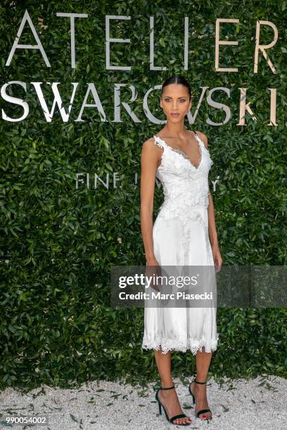 Model Noemie Lenoir attends the Atelier Swarovski : Cocktail Of The New Penelope Cruz Fine Jewelry Collection as part of Paris Fashion Week on July...