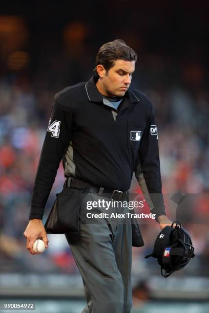 Umpire John Tumpane looks on during a game between the Colorado Rockies and the San Francisco Giants at AT&T Park on Tuesday, June 26, 2018 in San...