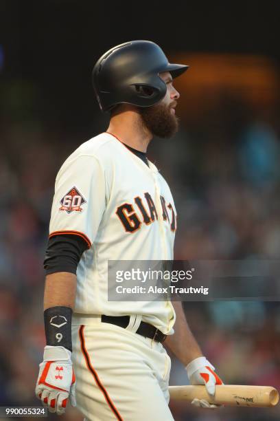 Brandon Belt of the San Francisco Giants looks on during a game against the Colorado Rockies at AT&T Park on Tuesday, June 26, 2018 in San Francisco,...