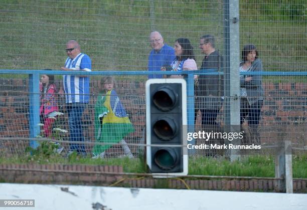 Fans look on at Central Park which also doubles as a stock car racing circuit during the pre-season friendly between Cowdenbeath and Dundee at...